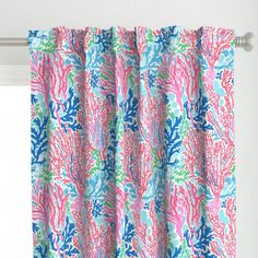 a pink and blue curtain with corals on it