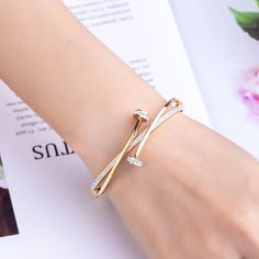 This Cycolinks double crystal Nail bracelet is the perfect piece to add some edge to your look. Specially designed to look like a nail wrapped around your wrist, slap this around your wrist to show off your love for a mechanical mind, so unique and rare to find. ✔️ FREE Worldwide shipping, we ship to over 250 Countries! ✔️ 316L Stainless Steel & cubic zirconium ✔️ Width: 0.6cm ✔️ Weight: 24g ✔️ Length: 17.5cm-18cm. ✔️ PERFECT GIFT – Ideal for friends/loved ones that enjoy all things to do with b Gold Bracelet Simple, Nail Bracelet, Gold Bangles For Women, Diamond Bracelet Design, New Gold Jewellery Designs, Modern Gold Jewelry, Bangles Jewelry Designs, Stainless Steel Bangles, Hand Bracelet