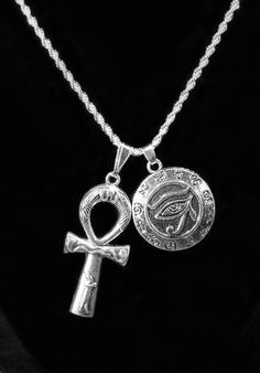 Silver Plated Ankh & Eye of Horus Duo Charm Necklace Choose YOUR chain! Large Ankh Charm measures 1.75 inches high Ankh is 0.75 inches wide Stainless Steel--with Silver Plating. Eye of Horus charm is 30 mm about the size of a USA Quarter. Horus charm is hollow on backside. Choose your chain from our pull-down menu above: A } a 925 Sterling Silver ROPE chain 2mm wide by 45 cm long (about 17.7 inches) OR b} a Silver ROPE Chain 2mm/ 50 cm = 19.7 inches with lobster clasp. Eco-Gift packaged. USA Unique Silver Ankh Jewelry, Spiritual Ankh Necklace With Adjustable Chain, Sterling Silver Ankh Amulet Necklace, Silver Ankh Gothic Necklace, Elegant Ankh-shaped Hallmarked Necklace, Ankh Necklace, Diy Charm Bracelet, Eye Of Horus, Egyptian Jewelry