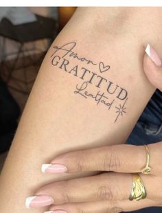 a woman's arm with tattoos on it that says, i am not grateful