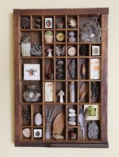 a wooden box filled with lots of different types of rocks and stones on top of it