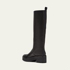 Loeffler Randall "Carlee" smooth calf leather tall moto boots 2.25 in / 55 mm block heel; 1.00 in / 25 mm platform Round toe Pull-on style Pull tab at collar Lugged rubber outsole Lining: Goat leather Professional cleaning recommended Imported Wide Calf Knee-high Platform Boots With Lug Sole, Knee-high Platform Boots With Wide Calf And Lug Sole, Knee-high Platform Boots With Lug Sole For Work, Knee-high Reinforced Heel Moto Boots For Work, Knee-high Moto Boots With Reinforced Heel For Work, Knee-high Heeled Boots With Lug Sole, Medium Width Knee-high Boots With Lug Sole, Knee-high Boots With Lug Sole, Workwear Platform Boots With Lug Sole And Block Heel