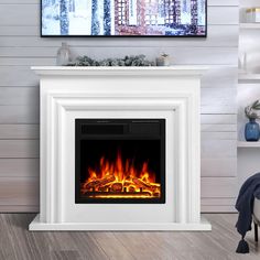 a white fireplace with bright flames in it