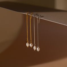 It’s as easy as pie to throw on our Pearl Threader Earrings and put an outfit together. Glamorous and dainty, these dangling charm earrings are minimalistic and perfectly stack with other earrings in your collection. Material: High Quality Solid 925 Sterling Silver Finish: 18K Gold ∙ Sterling Silver Featuring ~0.7mm Thick Chain Earrings ~60mm in Length, with a ~5.5x4.5mm Pearl Charm Sold as a pair Part of our Pearl Collection Model showcases a glamorous, event-ready look featuring Pearl Station Everyday Dangle Earrings With Delicate Chain, Sterling Silver Earrings With Delicate Chain For Everyday, Everyday Dainty Dangle Linear Earrings, Minimalist Dangle Earrings With Delicate Chain, Everyday Delicate Chain Dangle Earrings, Delicate Chain Long Drop Earrings For Everyday, Everyday Sterling Silver Earrings With Delicate Chain, Minimalist Everyday Earrings With Dangling Charms, Dainty Dangle Threader Earrings For Everyday