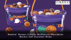 two buckets filled with halloween treats on top of a purple background and the words dunkin'donuts beneath them