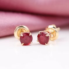 Product Details Add a touch of dazzle to your style with our Solitaire Stud Earrings, featuring a 5 MM Round Shape Created Ruby Solitaire that is sure to complement your look perfectly. These earrings are the perfect way to add a pop of color and sophistication to any outfit, making them a must-have addition to your jewelry collection. Product Information SKU SHP-EARRINGS112031152 Length 5 mm Width 5 mm Weight 1.20 gm (Approximate) LAB CREATED RUBY INFORMATION No.of Stones 2 Pieces Total Weight Ruby Earrings Studs, Precious Gemstones Jewelry, Solitaire Earrings, Great Gifts For Women, Solitaire Studs, Ruby Earrings, Round Stud Earrings, Birthstone Earring, Ruby Gemstone