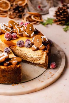 there is a cake that has been cut into pieces and served on a plate with other desserts in the background