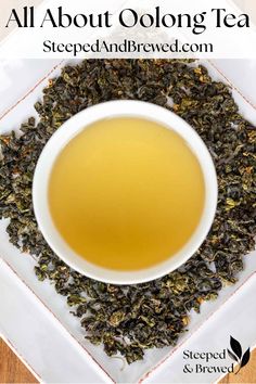 a white bowl filled with green tea on top of a wooden table