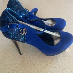 Blue High Heels Blue Ankle Strap Heels For Party, Blue High Heel Party Shoes, Blue 4-inch Heel Party Heels, Blue Party Heels With 4-inch Heel, Blue 4-inch Heels For Party, Blue Ankle Strap Heels For Evening, Blue High Heels With 4-inch Heel, Blue Heels With 4-inch Heel For Night Out, Blue Pointed Toe Heels For Night Out