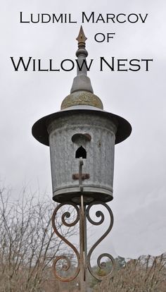 an old fashioned street light with the words lummi marco of willow nest on it