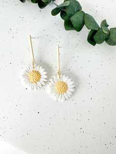 These white daisy earrings add the perfect floral statement to your spring outfits! Floral details are sculpted individually by hand in small batches. Shop the rest of the floral collection here: https://www.etsy.com/shop/PaintedLeafStudioCo?section_id=47823729 Earrings measure approximately 2 inches in length and 1 inch in width and are lightweight. Hand sculpted polymer clay earrings, crafted delicately and finished with attention to detail. Hypoallergenic nickel-free posts, hoops, hooks, and White Flower-shaped Trendy Earrings, Trendy White Flower-shaped Earrings, White Daisy-shaped Jewelry For Spring, White Daisy-shaped Spring Jewelry, Spring 3d Flowers Dangle Earrings, White Dangle Flower Earrings For Spring, Handmade Flower Dangle Earrings For Spring, Spring Handmade Flower Dangle Earrings, Trendy White Earrings With Flower Charm