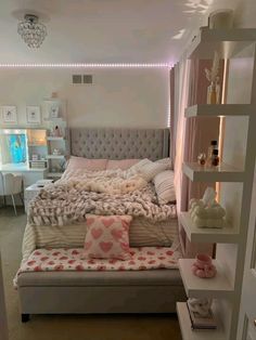 a bedroom with a bed and shelves in it