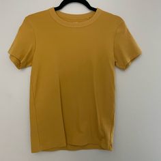 Excellent Condition Never Worn Mustard Yellow Color Size Small Mustard Yellow Color, Uniqlo Tops, Uniqlo Women, Yellow T Shirt, Gold Yellow, Mustard Yellow, Yellow Color, Uniqlo, Capsule Wardrobe