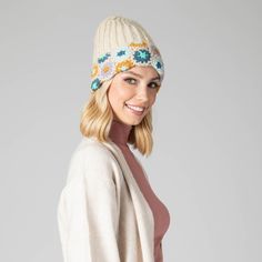 For cold weather with style, you can't beat this cozy Curb Crochet Beanie! With its adorable pastel floral accent, you'll look bright and cheery even when the weather isn't! Make winter a breeze with this hand-knit and cuffed beanie! Features: Color: PastelMaterials: 100% AcrylicSize: 57cmCold Weather Fitted Crochet Hat For Spring, Cream Crochet Hat For Fall, Whimsical Crochet Hat For Winter, Whimsical Winter Crochet Hat One Size, Whimsical One Size Crochet Hat For Winter, Whimsical Winter Crochet Hat, Cream Crochet Hat For Spring, One Size, Hand Knitted Crochet Hat For Spring, One Size, Cream Crochet Hat One Size For Spring