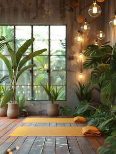 a yoga mat is on the floor in front of some plants and hanging light bulbs