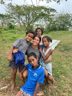 a group of young children posing for a photo