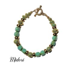 "Handcrafted gorgeous bracelet! If you like turquoise color jewelry with gold accents this is the for you! Blue-green beads are uniquely faceted. Gold beads have a fine green patina along with a different shade of gold coin spacers. Personally, this is one of my favorites! Can be worn with jeans or dress-up occasion. Well-made and sure to last. 7.5\" length." Beaded Gifts, Gold Beaded Bracelet, Green Beaded Bracelets, Bracelets Beaded, Green Patina, Color Jewelry, Gold Bead Bracelets, Green Beads, Shades Of Gold