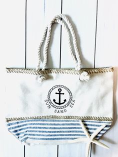 Shop The Nautical Collection. A perfect high quality tote for beach or pool. -durable, high quality, lined polyester bag. -19.5" x 13.25" x 6.25" - magnetic clasp  -rope handle Nautical Beach Bag In Sail Color, Nautical Style Beach Tote Bag For Travel, Nautical Style Tote Beach Bag For Travel, Nautical Sail-colored Beach Bag, Nautical Tote Beach Bag For Travel, White Nautical Bags For Summer, White Nautical Summer Bags, Nautical Style Beach Tote Bag, Rectangular Sail-colored Beach Bag