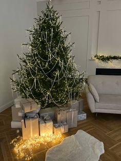 a living room with a christmas tree and presents on the floor