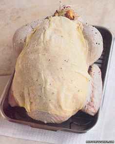 a piece of meat sitting in a container on top of a table