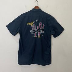 [DESCRIPTION] Please read the description first before buy my items‼️‼️ Vintage Dickies Embroidered Big Logo Tee Size on tag : M Tag says M,fits like M (please refer the actual measurements given and compare it with best fitting clothes,by using the size on tag is not always accurate) All in good condition [MATERIAL] Cotton [MEASUREMENT] Measurement:  armpit to armpit : 20 inches  Back collar to bottom : 28 inches [CONDITION] - All in good condition  - Kindly please refer photo [PAYMENT & NOTICE] - No return/refund - All items will be post over shipping company counter within 1-3 working days after payment completed and please allow 1-4 weeks for shipping delivery to your destination. -We are trusted seller. Do message me if you have any questions to ask about this item. -Dont Worry About Casual Embroidered Button-up Camp Shirt, Casual Embroidered Cotton Camp Shirt, Dickies Shirt Outfit, Button Ups, Fitting Clothes, Vintage Dickies, Logo Tee, Logo Tees, Mens Graphic Tee