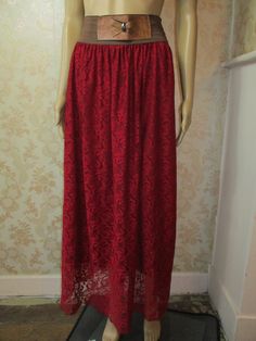 "Vintage lace maxi skirt with a brown elastic waist and a brown vynil bow.    The underskirt is maroon,  the lace top skirt is dark red. Waist flat;  15\" Length;  42\" Made in France synthetic" Long Skirt With Lace Patchwork For Party, Elegant Flowy Maxi Skirt With Lace Trim, Lace Maxi Skirt For Spring, Lace Trim Maxi Skirt For Wedding, Summer Evening Lace Skirt, Lace Full Skirt For Wedding, Summer Lace Maxi Skirt, Lace Lined Skirt For Party, Lace Party Skirt With Lining