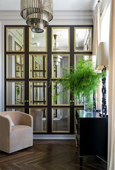 a living room filled with furniture and a plant