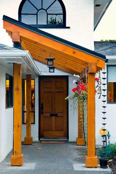 a white house with a wooden front door