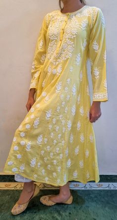 Made from Soft Pure Cotton , the Maharani Dress is Highlighted by Fish Kali panels to give it the voluminous flair The panels are distinguished from each other by different sets of motifs and embroidered intricately in Chikankari throughout the length of the piece. Prewashed. Preshrunk. Bucket wash and line dry and light iron for best results. Length - 48 inches sizes - S - fits bust 34 M - fits bust 36 L - fits bust 38 XL - fits bust 40 0X - fits bust 42 1X - fits bust 44 Anaar Kali Dress, Chanderi Kurta With Floral Embroidery In Maxi Length, Chanderi Floral Embroidered Dress For Eid, Spring Bohemian Chanderi Dresses, Yellow Bohemian Designer Dress, Designer Chanderi Dress With Floral Embroidery, Spring Festive Chanderi Dress, Bohemian Chanderi Dress With Chikankari Embroidery, Spring Chikankari Embroidered Chanderi Dress