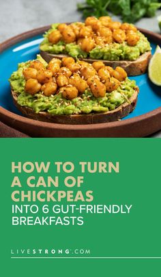 two pieces of bread with guacamole and shrimp on top, sitting on a blue plate