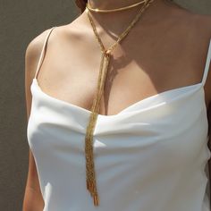 One of Camille's personal favorites! Not only is this style ultra versatile...could be worn 4 different ways!!! This scarf chain necklace looks spectacular worn alone or layered up! The Anuket versatile scarf chain necklace comes in a half hard collar with 10 strands of our signature faceted tubular design chain. Brass base 18K gold plated 4mm half hard round collar with caps: Size: 5 3/4" W x 3 3/4" H Tube design end caps. Size: 2.4mm x 19mm Delicate faceted tube chains Customize look up to fou Formal Yellow Gold Brass Chain Necklace, Luxury Brass Chain Necklace, Luxury Delicate Chain Brass Necklace, Long Gold-tone Brass Chain Necklace, Gold Fashion Jewelry, Gold Scarf, Luxury Gold-tone Brass Chain Necklace, Tube Design, Gold Fashion