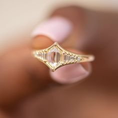 Art Deco inspired engagement ring with one of a kind rose cut diamond and an assemblage of gradient in size baguette cut diamonds from each side. This ring is beaming with light and elegance! MATERIALS: 18k gold | 0.7 carat duchess shape hexagon step cut diamond (OOAK) | assemblage of 10 gradient in size baguette and carre cut diamonds YELLOW 18k gold. Diamond total carat weight: 0.84 Band width: 2 mm Ready to ship in 2-3 weeks. All of our items are MADE TO ORDER, so we need some time to create Diamond White Radiant Cut Rose Cut Diamond Ring, Diamond White Diamond Ring With Rose Cut Radiant Diamonds, Diamond White Radiant Cut Ring With Rose Cut Diamonds, Wedding Diamond Ring With Baguette And Asscher Cut Diamonds, Heirloom Baguette Cut Diamond Ring With Rose Cut Diamonds, Heirloom Rose Cut Baguette Diamond Ring, Heirloom Baguette Cut Rose Cut Diamond Ring, Wedding Rings With Baguette Diamonds And Asscher Cut, Emerald Cut Rose Diamond Wedding Ring