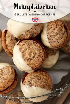 cookies with white icing and crumbs in a glass bowl