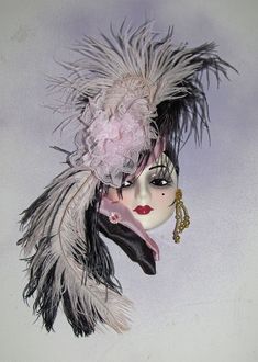 a woman's head with feathers on it