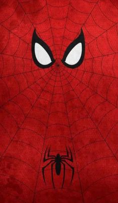 a close up of a spiderman face on a red background with white and black eyes