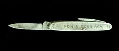 an old knife with the words for a good boy on it