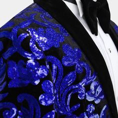 a man in a tuxedo with blue sequins on it