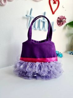 Refresh your accessory selection with our sassy tote bag. This cute cotton fabric tote features a snap enclosure and 1 main compartment to store all of your belongings. The Tote bagpurse measures approximately H13cm x W14cm. Its suitable for Children Ages 2 to 5years.It is made from 100% Cotton Canvas Fabric with 3 layers of soft Tulle and text is heat pressed using glitter vinyl. You can also drop me a message if you want this design in a different colour. Toddler Tote Bag, Toddler Purse, Kids Tote Bag, Sewing Easy, Sewing Easy Diy, Crochet Stitches For Blankets, Purple Purse, Toddler Bag, Girls Stuff