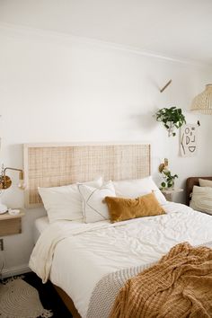 Boho style bedroom with neutral tones, decor, hanging plants, and DIY cane headboard. Diy Boho Headboard, Diy Cane Headboard, Cane Headboard, Boho Headboard, Caned Headboard, Diy Headboards, Diy Boho, Diy Home Decor Bedroom