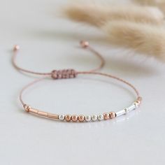 Custom personalized Morse code bracelet - special gift for your loved one! ✦ Makes a great gift for sister, mom, wife, aunt, bridesmaid ✦ Adjustable up to approx 9 3/4 inches (25cm) with sliding knot ✦ Rose Gold Vermeil beads ✦ .925 sterling silver beads ✦ Round beads represent dots, tubes dashes ☆ Find more Morse code bracelets: https://www.etsy.com/shop/ANINAjewelry/items?section_id=22949863 Morse code is an alphabet in which letters are represented by combinations of long and short signals. E Minimalist Adjustable Bracelets For Birthday, Minimalist Adjustable Bracelet For Birthday, Adjustable Rose Gold Beaded Bracelet As Gift, Adjustable Rose Gold Name Bracelet For Personalized Gift, Adjustable Rose Gold Friendship Bracelet Gift, Adjustable Rose Gold Friendship Bracelet, Handmade Rose Gold Friendship Bracelets, Minimalist Rose Gold Beaded Bracelets As Gift, Adjustable Rose Gold Bracelet As A Gift