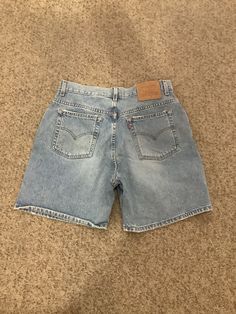 This nice pair of 90s vintage denim Levi's Mom shorts comes to you in a size 14 on tag but on,y go by the measurements. They are 16 inches across waist-rise is 12 inches- inseam is 6 1/4 inches. Can always roll up. Hips 23 3/4 to 24 inches across. Cheap 90s Style Short Jeans, Retro Cutoff Jean Shorts For Streetwear, Vintage Medium Wash Shorts For Streetwear, Vintage Relaxed Fit Jean Shorts For Streetwear, Vintage Medium Wash Straight Leg Shorts, 90s Light Wash Jean Shorts For Streetwear, Vintage Medium Wash Jean Shorts For Streetwear, 90s Denim Jean Shorts, Vintage Denim Shorts For Streetwear