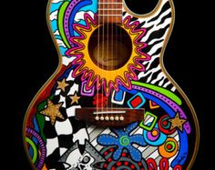 a colorful guitar with an intricate design on the top and bottom, sitting in front of a black background