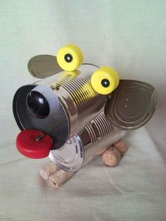 a tin can dog with googly eyes on it