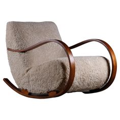 a chair that is made out of sheep's wool and has a wooden frame