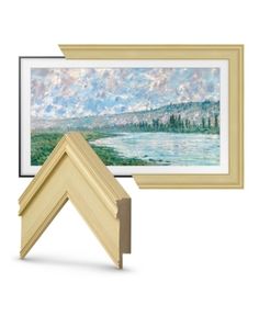 two framed paintings and a wooden frame with an image of a lake in the background