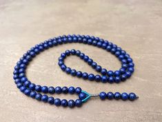 Lapis lazuli mala necklace rosary 108 prayer beads excellent quality natural genuine afghan blue lapis gemstone  Assembled by professional macrame master, durable construction Natural excellent quality Lapis lazuli gemstone 108 beads mala and necklace Beads size: 7.4-7.7mm Necklace length: 80cm Blue Round Beads Mala For Meditation, Blue Gemstone Beads Rosary For Spiritual Use, Blue Spiritual Rosary With Gemstone Beads, Spiritual Blue Rosary With Gemstone Beads, Blue 8mm Beads Spiritual Mala, Blue Mala With 8mm Beads For Meditation, Blue Spiritual Mala With 8mm Beads, Spiritual Blue Mala With 108 Beads, Blue 108 Beads Spiritual Rosary