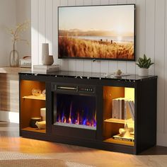 an entertainment center with a fire place and television on the wall in front of it