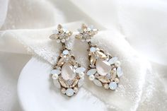 Crystal Bridal earrings, Chandelier earrings, Bridal jewelry, Vintage Wedding earrings, Statement earrings, Vintage style Wedding jewelry by treasures570 on Etsy Gold Crystal Chandelier Earrings For Wedding, White Crystal Embellished Wedding Earrings, White Crystal Embellished Bridal Earrings For Wedding, Gold Chandelier Earrings With Crystals For Wedding, Glamorous White Crystal Wedding Earrings, Crystal Jeweled Bridal Earrings For Wedding, Exquisite Jeweled Earrings For Wedding, Jeweled Chandelier Drop Earrings For Wedding, Elegant Jeweled Chandelier Earrings For Wedding