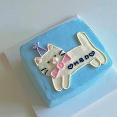 a birthday cake with a cat on it