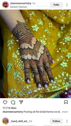 the henna is on someone's hand and it looks like they are getting married